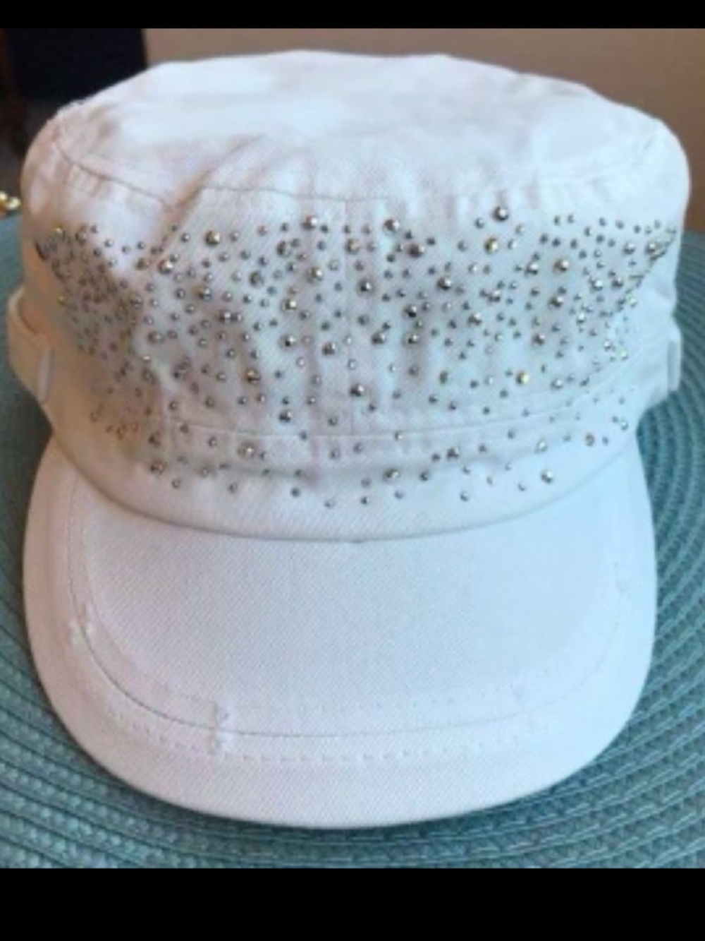 BLINGY BILLED HAT. Distressed White denim with bling & button accents.